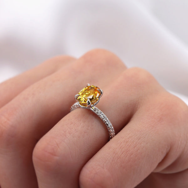 Yellow sapphire and white metal engagement ring 