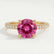 Catalina solitaire engagement ring in 18k yellow gold with a round pink lab-grown sapphire centre stone, front view.