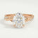 Eden vine solitaire engagement ring in 18k rose gold with an oval moissanite centre stone and diamond accents, front view.