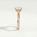 Eden vine solitaire engagement ring in 18k rose gold with an oval moissanite centre stone and diamond accents, end-on view showing the setting and band.