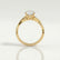 Eden vine solitaire engagement ring in 18k yellow gold with an oval natural diamond centre stone, side profile showing the setting and band.