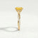 Eden vine solitaire engagement ring in 18k yellow gold with an oval yellow lab-grown sapphire centre stone and diamond accents, end-on view showing the setting and band.