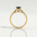 Elena solitaire engagement ring in 18k yellow gold with a round lab-grown alexandrite centre stone, side profile showing the setting and band.