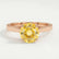 Elena solitaire engagement ring in 18k rose gold with a round yellow lab-grown sapphire centre stone, front view.