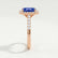 Esme halo engagement ring in 18k rose gold with a radiant blue lab-grown sapphire centre stone and diamond accents, end-on view showing the setting and band.