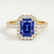 Esme halo engagement ring in 18k yellow gold with a radiant blue lab-grown sapphire centre stone and diamond accents, front view.