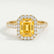 Esme halo engagement ring in 18k yellow gold with a radiant yellow lab-grown sapphire centre stone and diamond accents, front view.