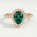 Harlow halo engagement ring in 18k rose gold with a pear-shaped lab-grown emerald centre stone and diamond accents, front view.