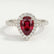 Harlow halo engagement ring in platinum with a pear-shaped lab-grown ruby centre stone and diamond accents, front view.