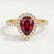 Harlow halo engagement ring in 18k yellow gold with a pear-shaped lab-grown ruby centre stone and diamond accents, front view.