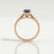 Isabella solitaire engagement ring in 18k rose gold with an oval lab-grown alexandrite centre stone, end-on view showing the setting and band.