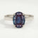 Isabella solitaire engagement ring in 18k white gold with an oval lab-grown alexandrite centre stone, front view.