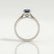 Isabella solitaire engagement ring in 18k white gold with an oval lab-grown alexandrite centre stone, end-on view showing the setting and band.