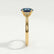 Isabella solitaire engagement ring in 18k yellow gold with an oval lab-grown alexandrite centre stone, side profile showing the setting and band.