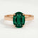 Isabella solitaire engagement ring in 18k rose gold with an oval lab-grown emerald centre stone, front view.