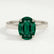 Isabella solitaire engagement ring in 18k white gold with an oval lab-grown emerald centre stone, front view.