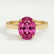 Isabella solitaire engagement ring in 18k yellow gold with an oval pink lab-grown sapphire centre stone, front view.