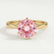 Juliet solitaire engagement ring in 18k yellow gold with a round morganite-pink lab-grown sapphire centre stone, front view.