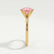 Juliet solitaire engagement ring in 18k yellow gold with a round morganite-pink lab-grown sapphire centre stone, end-on view showing the setting and band.