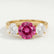LEANORA - Round Pink Sapphire 18k Yellow Gold Trilogy