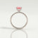 Lively hidden halo engagement ring with a cushion morganite-pink lab-grown sapphire centre stone on a pavé-set band, side profile showing the setting and band.