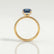 Lively hidden halo engagement ring in 18k yellow gold with an elongated cushion lab-grown alexandrite centre stone on a pavé-set band, side profile showing the setting and band.