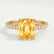 Lively hidden halo engagement ring in 18k yellow gold with an elongated cushion yellow lab-grown sapphire centre stone on a pavé-set band, front view.