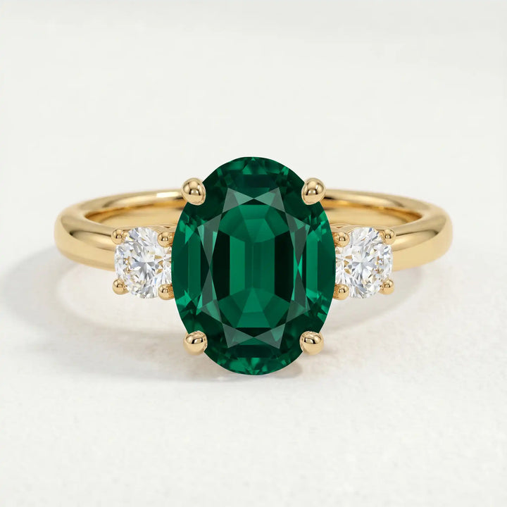 LOUELLA - Oval Emerald Oval Petite Trilogy Engagement Ring 18k Yellow Gold