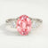 Louella trilogy engagement ring with an oval morganite-pink lab-grown sapphire centre stone, front view.