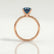 Lulu solitaire engagement ring in 18k rose gold with an elongated cushion lab-grown alexandrite centre stone, side profile showing the setting and band.