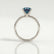 Lulu solitaire engagement ring in 18k white gold with an elongated cushion lab-grown alexandrite centre stone, side profile showing the setting and band.