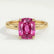 Lulu solitaire engagement ring in 18k yellow gold with an elongated cushion pink lab-grown sapphire centre stone, front view.