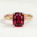 Lulu solitaire engagement ring in 18k rose gold with an elongated cushion lab-grown ruby centre stone, front view.