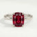 Lulu solitaire engagement ring in platinum with an elongated cushion lab-grown ruby centre stone, front view.