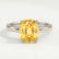Lulu solitaire engagement ring in 18k white gold with an elongated cushion yellow lab-grown sapphire centre stone, front view.