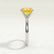 Lulu solitaire engagement ring in platinum with an elongated cushion yellow lab-grown sapphire centre stone, end-on view showing the setting and band.
