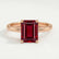 Lulu solitaire engagement ring in 18k rose gold with an emerald-cut lab-grown ruby centre stone, front view.