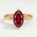 Lulu solitaire engagement ring in 18k yellow gold with a marquise lab-grown ruby centre stone, front view.