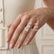 Cushion-cut diamonds shown on a finger for size comparison, labelled 2.00ct, 3.00ct and 4.00ct.