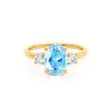 LOUELLA - Chatham® Oval Aqua Spinel Oval Petite Trilogy Engagement Ring 18k Yellow Gold