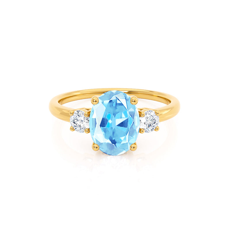 LOUELLA - Chatham® Oval Aqua Spinel Oval Petite Trilogy Engagement Ring 18k Yellow Gold