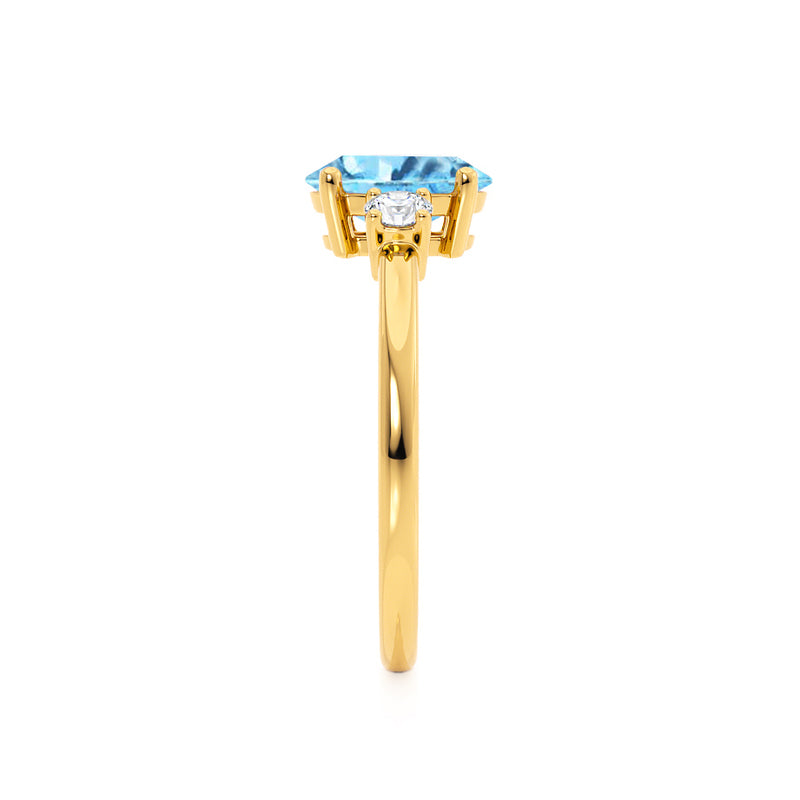 LOUELLA - Chatham® Oval Aqua Spinel Oval Petite Trilogy Engagement Ring 18k Yellow Gold