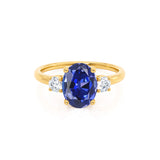 LOUELLA - Chatham® Oval Blue Sapphire Oval Petite Trilogy Engagement Ring 18k Yellow Gold