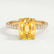Macy shoulder-set engagement ring in 18k yellow gold with an elongated cushion yellow lab-grown sapphire centre stone, front view.