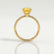 Macy shoulder-set engagement ring in 18k yellow gold with an elongated cushion yellow lab-grown sapphire centre stone, side profile showing the setting and band.