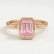 Front view of a pink emerald-cut lab-grown diamond engagement ring in a 18k rose gold bezel setting