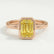 Front view of a yellow emerald-cut lab-grown diamond engagement ring in a 18k rose gold bezel setting