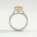 Side view of a yellow emerald-cut lab-grown diamond engagement ring in a platinum bezel setting