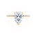 A solitaire engagement ring with a pear cut lab diamond centerpiece, set in a yellow gold band.
