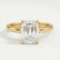 Paris hidden halo engagement ring in 18k yellow gold with an emerald-cut moissanite centre stone and diamond accents, front view.